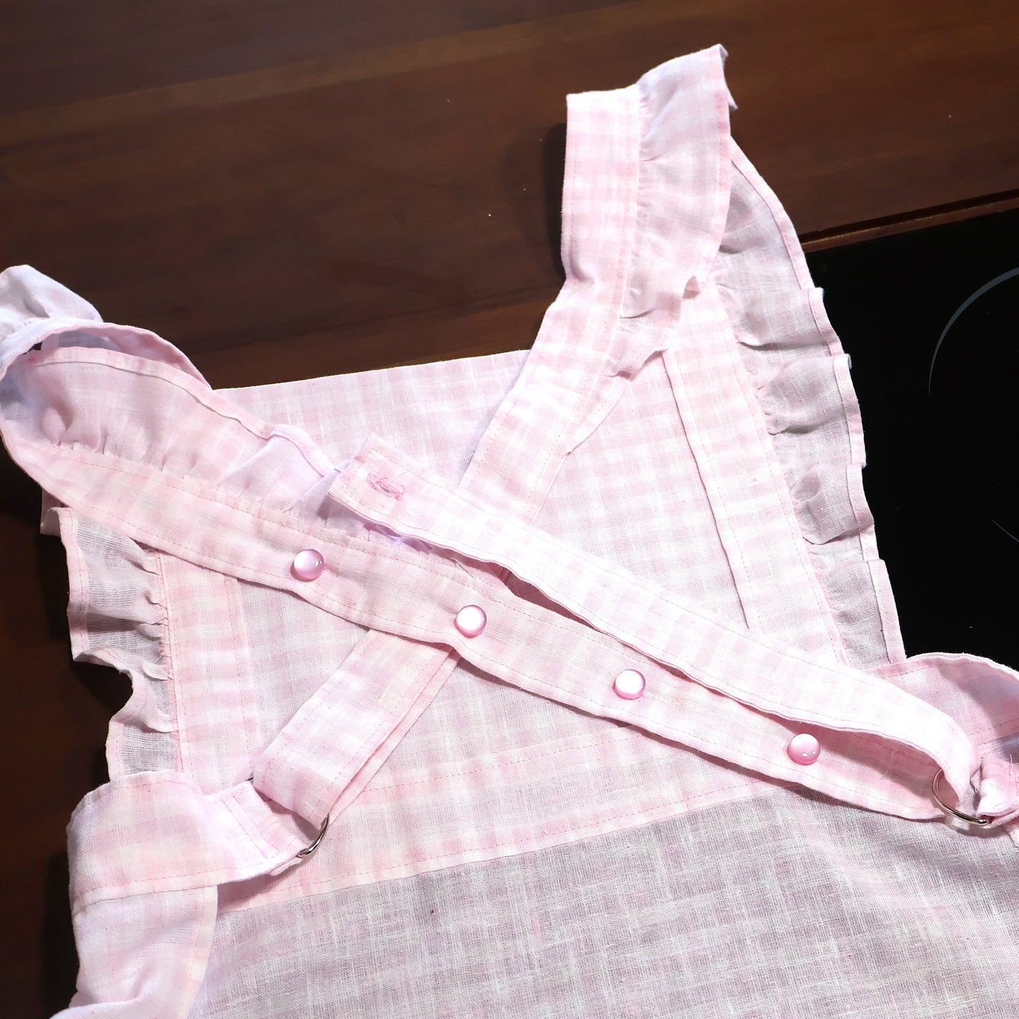 The Willow Ruffle Cross-Back Apron | Adjustable Linen Apron | Feminine Blush Checkered Cottage Apron